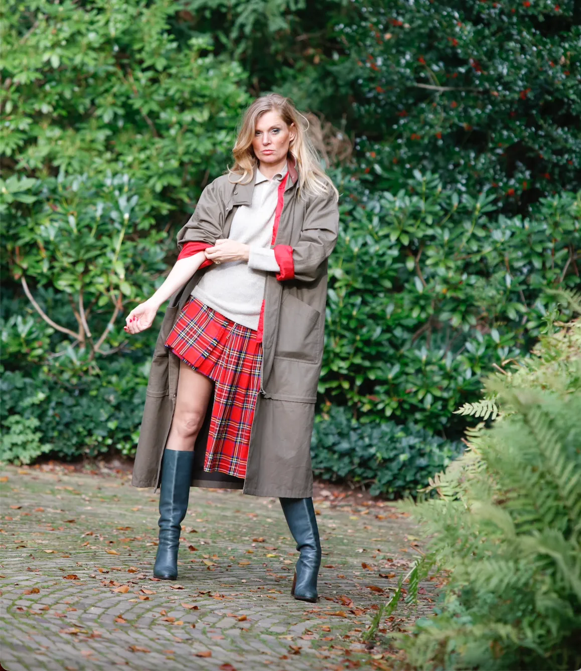 Long khaki brown vintage coat with quilted inner red jacket.